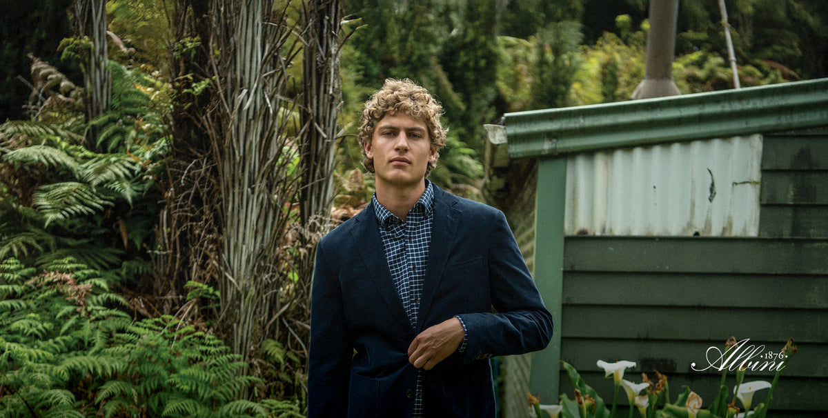 Man wearing a Rodd & Gunn navy blazer outdoors, shop Rodd & Gunn at The Point Clothing Lounge