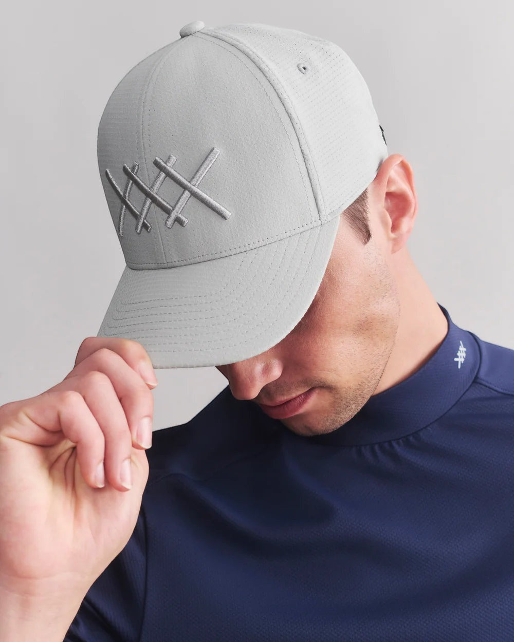 The Point Clothing Lounge's Rhone gray performance snapback cap with embroidered logo, adjustable fit, and breathable fabric.