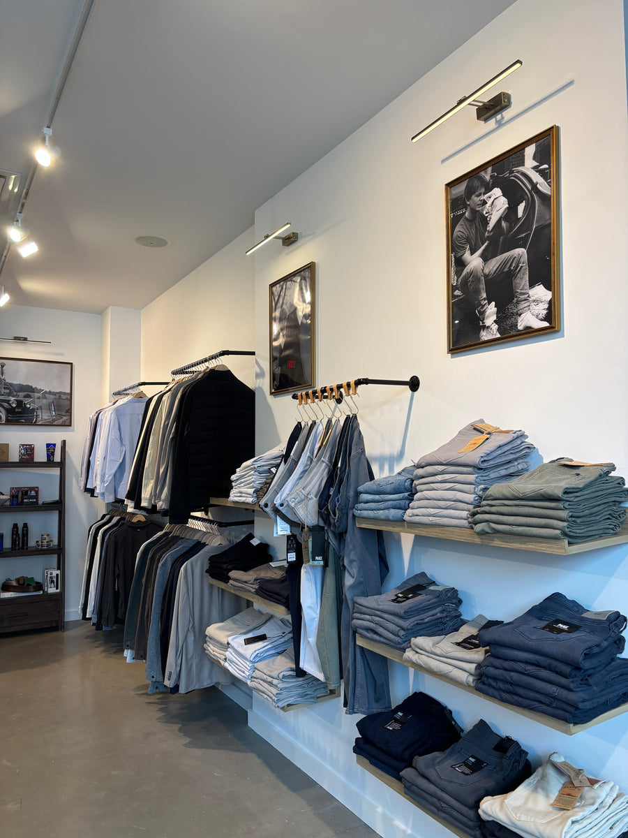 Denim and menswear display inside The Point Clothing Lounge in Lynnfield, MA